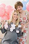 Woman Holding a Gift at a Baby Shower