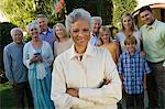 Senior woman celebrating with friends in garden