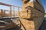 House construction and stack of planks