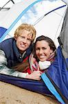 Young Couple Lying Down in Tent.