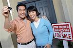 Couple with keys to new home