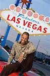 Man sitting on bonnet of car in Las Vegas