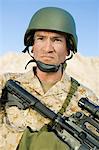 Soldier wearing helmet, outdoors, (close-up), (portrait)