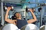 Man Weightlifting on Bench With Dumbbells