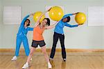 Women Using Exercise Balls in Fitness Class