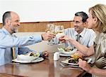 Businesspeople toasting drinks in restaurant