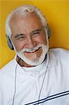 Portrait of elderly man wearing headphones
