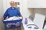 Elderly man with laundry basket