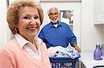 Senior couple with laundry