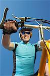 Young man on bicycle outdoors