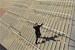 Businessman shouting on stairs, elevated view