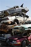 Stacked cars in junkyard