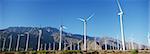 Valley of wind turbines in desert