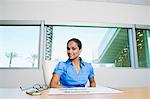 Businesswoman Sitting at Table