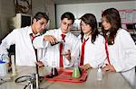 High School Students Conducting Science Experiment