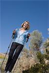 Mature woman with walking poles