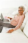 Cheerful Senior Woman Using Laptop