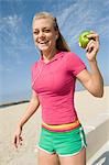 Young woman holding apple