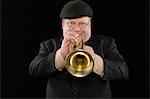 Mature man playing the trumpet