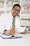 Male pharmactist working in pharmacy