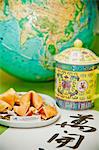 Still life with fortune cookies and globe