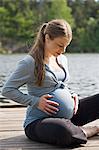 Pregnant woman on jetty