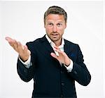 Studio portrait of businessman gesturing