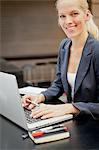 Portrait of young woman working with laptop