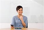 Portrait of smiling businesswoman using cell phone