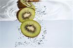 Kiwi halves submerged in water