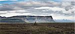 Iceland, panoramic view of lava field and cliffs