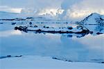 Iceland, Reykjanes Peninsula, Blue Lagoon geothermal spa, geothermal power plant in background