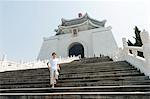 Boy going down steps of Chiang Kai-shek Memorial Hall, Taipei, Taiwan