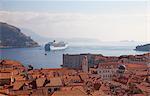 Rooftops, cruise ship and the island of Lokrum from Dubrovnik Old Town walls, Dubrovnik, Croatia, Europe