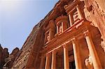 The facade of the Treasury (Al Khazneh) carved into the red rock at Petra, UNESCO World Heritage Site, Jordan, Middle East