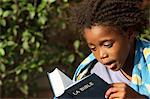 Father and daughter reading the Bible, Lome, Togo, West Africa, Africa