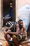African woman carrying her baby on her back, Lome, Togo, West Africa, Africa