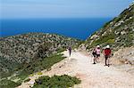 Walkers on coastal walk, Akrotiri Peninsula, Chania region, Crete, Greek Islands, Greece, Europe