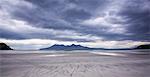 Early evening view towards Rum from the Bay of Laig on Eigg, Inner Hebrides, Scotland, United Kingdom, Europe