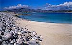 Sand and boulder beach on the island of Scarp just off the Isle of Harris on a late afternoon in June, Outer Hebrides, Scotland, United Kingdom, Europe