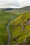 Cars travelling down Winnats Pass, Castleton, Peak District National Park, Derbyshire, England, United Kingdom, Europe