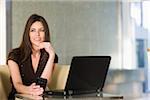 Woman with Cellular Telephone and Laptop, Florida, USA