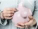 Woman saving money at rainy window