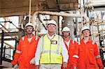 Workers walking at oil refinery