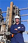 Worker standing at oil refinery