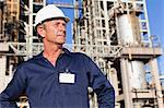 Worker standing at oil refinery