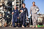 Workers walking at oil refinery