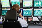 Man working in security control room