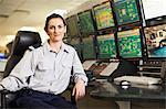 Woman working in security control room