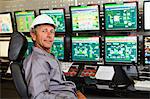 Man working in security control room